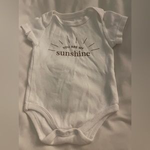 White unisex newborn “you are my sunshine” onesie.